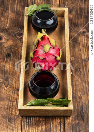 A glass of dragon fruit juice. 131760495