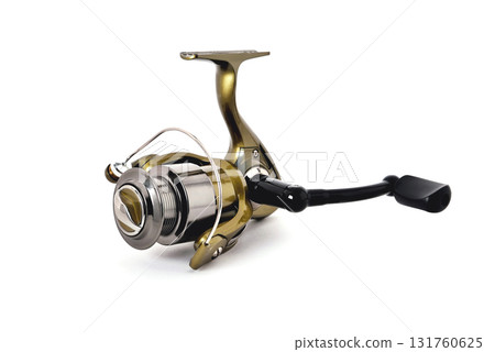 gold color fishing reel on a white background 131760625