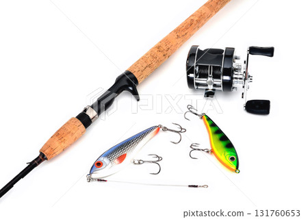 jerkeys spinning and multiplier reel for fishing on a white background close-up jerkeys spinning and multiplier reel for fishing on a white background close-up 131760653