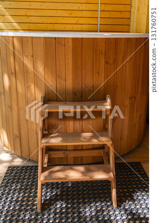 Wood hot tub steps, two-tier entry to a natural outdoor spa Wood hot tub steps, two-tier entry to a natural outdoor spa 131760751