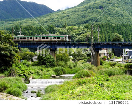 A Senzan Line train crossing a mountain river 131760931
