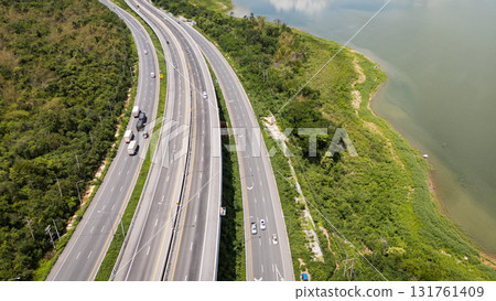 Drone shot The M6 motorway Nakhon Ratchasima Province - Bang Pa-in Lam Ta Khong River and Mountain. Motorway Korat Thailand Drone shot The M6 motorway Nakhon Ratchasima Province - Bang Pa-in Lam Ta Khong River and Mountain. Motorway Korat Thailand 131761409
