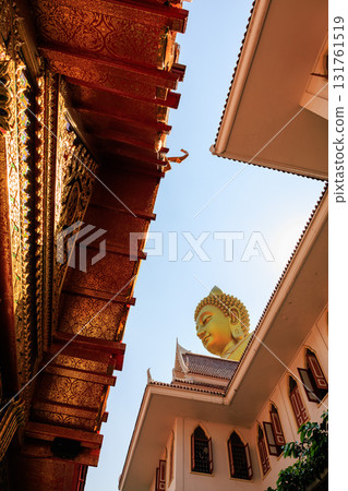 [Bangkok, Thailand] The golden Buddha statue of Luang Por Sod, Wat Pak Nam, seen from the street [Vertical photo] 131761519