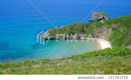 A spectacular, high-angle panoramic photograph capturing the secluded beauty of Playa de Torimbia on the coast of Asturias, Spain. A spectacular, high-angle panoramic photograph capturing the secluded beauty of Playa de Torimbia on the coast of Asturias, Spain. 131761750
