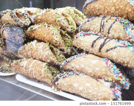 Sicilian cannoli with ricotta cheese cream and pistachio. Sicilian dessert in Italy 131761999