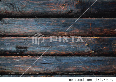 background from wooden logs of charred brown-black color background from wooden logs of charred brown-black color 131762089