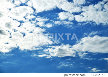 Clouds on the background of bright blue sky, summer day close-up Clouds on the background of bright blue sky, summer day close-up 131762143