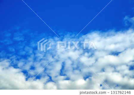 Clouds on the background of bright blue sky, summer day close-up 131762146