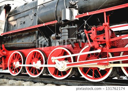 Part of the old railway locomatine standing on the rails 131762174