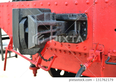 Part of the old railway locomatine standing on the rails 131762179