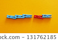 Weak link in connection. Clothespins holding each other except one. 131762185
