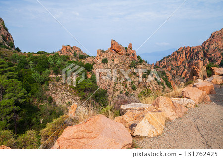 Calanques de Piana, Corsica, France. Roadside with massive stones 131762425