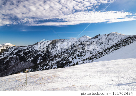 Snowy mountain range under a bright blue sky. The Mala Fatra national park in northwest of Slovakia, Europe. 131762454