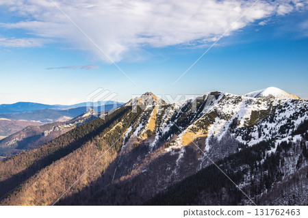 Snow-capped mountain range under a clear sky. The Mala Fatra national park in northwest of Slovakia, Europe. 131762463