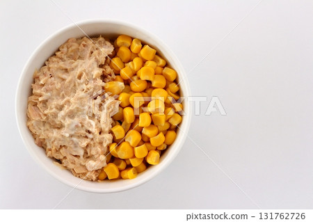 Tuna mayonnaise corn on a white background viewed from directly above 131762726