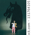 Modern composition. Little boy holding teddy bear standing before giant monster shadow with snake tongue 131764105