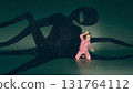 Collage art. Little girl making scary face before long shadow monster with multiple limbs 131764112