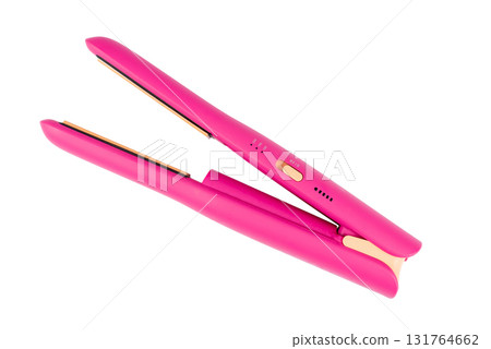 Cordless pink hair straightener, isolated on a white background. 131764662