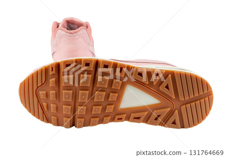 Pair of fashionable pink leather sneakers, isolated on a white background with one sneaker showing its sole. This photo is perfect for showcasing footwear or for use in fashion and lifestyle content. Pair of fashionable pink leather sneakers, isolated on a white background with one sneaker showing its sole. This photo is perfect for showcasing footwear or for use in fashion and lifestyle content. 131764669