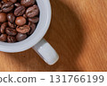 Cup of coffee seeds 131766199