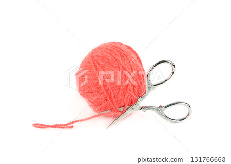 Ball of Coral Yarn and Decorative Vintage Scissors 131766668