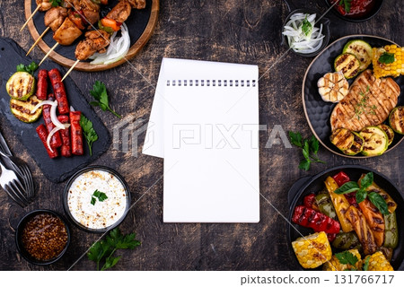 Assortment of grilled bbq meat and vegetables 131766717