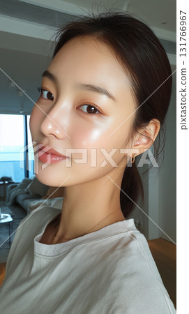 Korean woman with glowing skin in a modern indoor space during the day Korean woman with glowing skin in a modern indoor space during the day 131766967