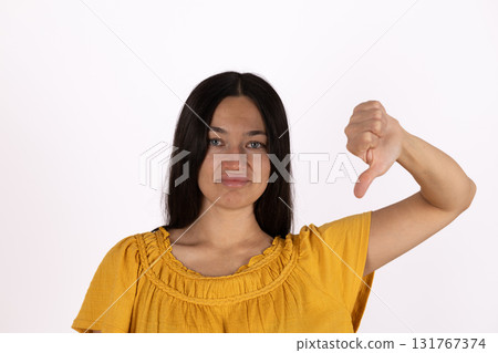 Woman in distress, thumb on face, surrounded by chaos Woman in distress, thumb on face, surrounded by chaos 131767374