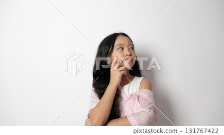 girl looking up at the sky,wonder in her eyes, surrounded by towering sunflowers 131767422