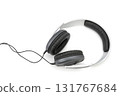 Modern wired over-ear headphones with black cushioned ear pads and silver headband isolated on white background, close-up studio shot for music technology and audio equipment concept 131767684
