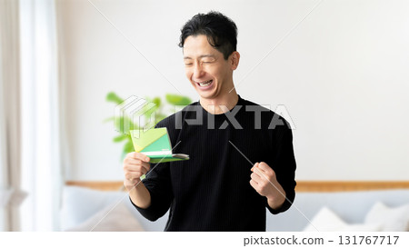 A man who is happy to see passbooks A man who is happy to see passbooks 131767717