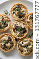 Photorealistic Chicken and Mushroom Tartlets on White Plate, Elegant Food Photography 131767777