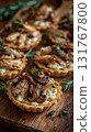 Photorealistic Chicken and Mushroom Tartlets on White Plate, Elegant Food Photography 131767800