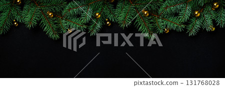 Christmas banner background with spruce branches and golden baubles. Black background with spruce branches and golden christmas ornaments Christmas banner background with spruce branches and golden baubles. Black background with spruce branches and golden christmas ornaments 131768028