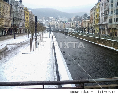 City streets, Baroque buildings, and a colonnade in winter. Snow creates a special atmosphere in the spa town. City streets, Baroque buildings, and a colonnade in winter. Snow creates a special atmosphere in the spa town. 131768048