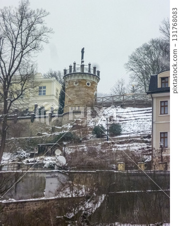 City streets, Baroque buildings, and a colonnade in winter. Snow creates a special atmosphere in the spa town. 131768083