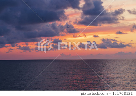 Shot of the dramatic sunset by the beach. Shot of the dramatic sunset by the beach. 131768121