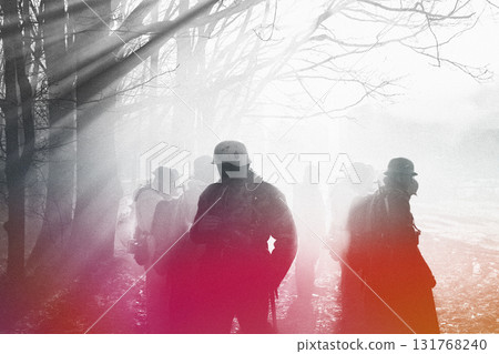 German Wehrmacht Infantry Soldier In World War II Standing In Dramatic Backlight Through Smoke During Historical Reenactment. Black, red and white colors. Blood concept 131768240