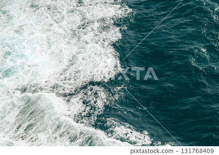Abstract blue sea water with white wave for background. High quality photo 131768409