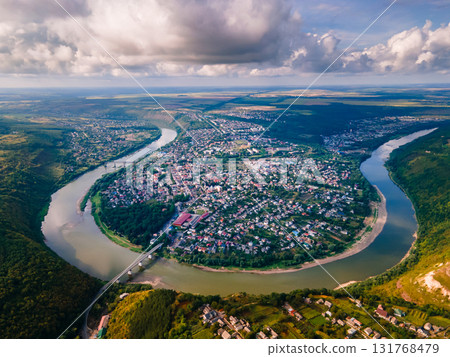 Aerial view of the summer Dnister river bend canyon and famous Ukrainian Zalischyky town. Ternopil region, Ukraine, Europe. High quality photo 131768479