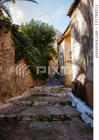 Plaka, Historical neighborhood in Athens, Greece. Residential Homes in a colorful street. Plaka, Historical neighborhood in Athens, Greece. Residential Homes in a colorful street. 131768511