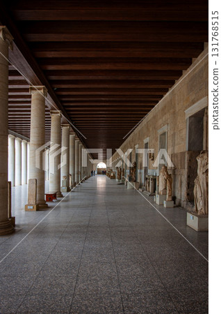 Building with many columns. A long passage between many old columns Building with many columns. A long passage between many old columns 131768515