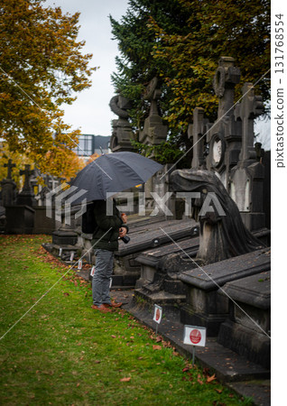 Ghent, Belgium - November 16 2024. Ancient cemetery tombs and grave stones on Campo Santo historical old graveyard in Sint-amandsberg municipality Ghent, Belgium - November 16 2024. Ancient cemetery tombs and grave stones on Campo Santo historical old graveyard in Sint-amandsberg municipality 131768554