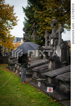 Ghent, Belgium - November 16 2024. Ancient cemetery tombs and grave stones on Campo Santo historical old graveyard in Sint-amandsberg municipality Ghent, Belgium - November 16 2024. Ancient cemetery tombs and grave stones on Campo Santo historical old graveyard in Sint-amandsberg municipality 131768558