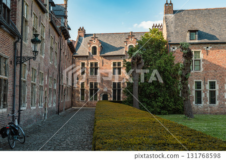 Leuven, Belgium - April 26, 2025: Historic quarter of Leuven with cobbled streets, medieval houses, and serene canals, UNESCO World Heritage Site. Leuven, Belgium - April 26, 2025: Historic quarter of Leuven with cobbled streets, medieval houses, and serene canals, UNESCO World Heritage Site. 131768598