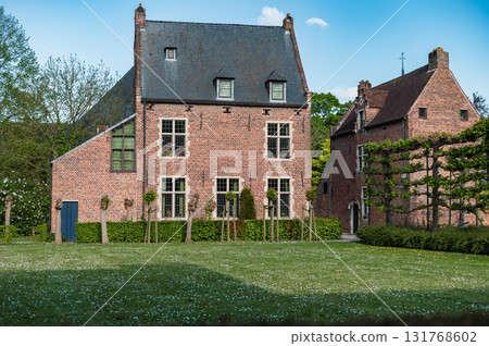 Leuven, Belgium - April 26, 2025: Historic quarter of Leuven with cobbled streets, medieval houses, and serene canals, UNESCO World Heritage Site. Leuven, Belgium - April 26, 2025: Historic quarter of Leuven with cobbled streets, medieval houses, and serene canals, UNESCO World Heritage Site. 131768602
