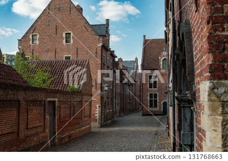 Leuven, Belgium - April 26, 2025: Historic quarter of Leuven with cobbled streets, medieval houses, and serene canals, UNESCO World Heritage Site. Leuven, Belgium - April 26, 2025: Historic quarter of Leuven with cobbled streets, medieval houses, and serene canals, UNESCO World Heritage Site. 131768663