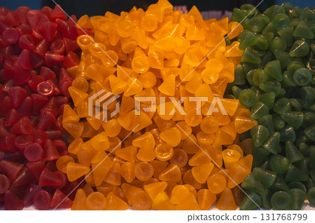 A cuberdon, a cone-shaped Belgian candy. It is also known in dutch as a neus (nose), Gentse neus (Ghent nose), or neuzeke (little nose) and in french as chapeau-de-pretre (priests hat). 131768799