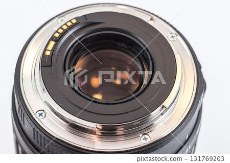 Close-up of rear end of DSLR zoom lens with bayonet ring and electrical contacts 131769203