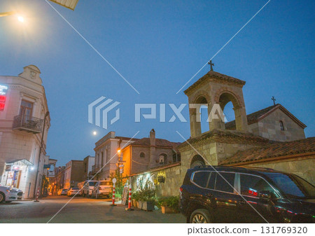 Small orthodox church on tall Kura riverbank 131769320